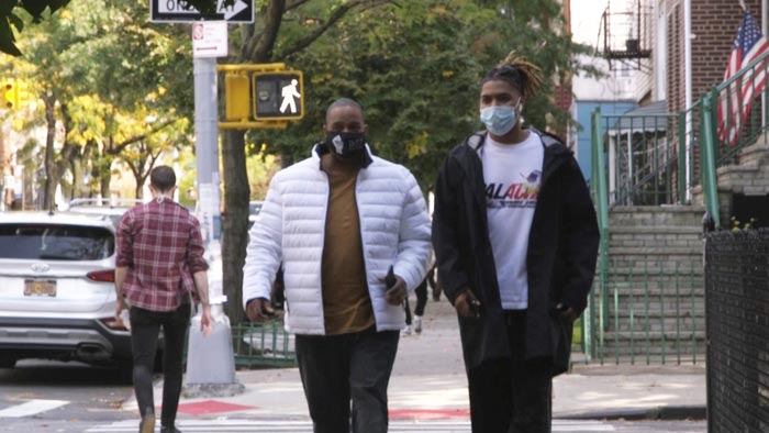 Photo of a dimly lit room with a computer interface terminal.