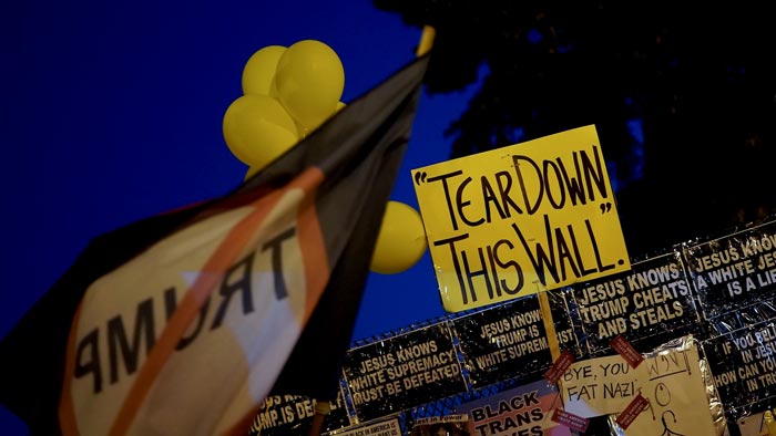 Photo of a dimly lit room with a computer interface terminal.