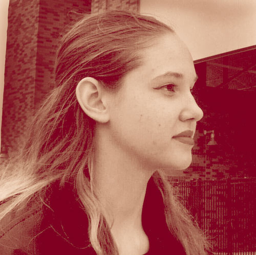 Photo of a dimly lit room with a computer interface terminal.