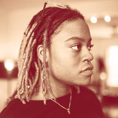 Photo of a dimly lit room with a computer interface terminal.